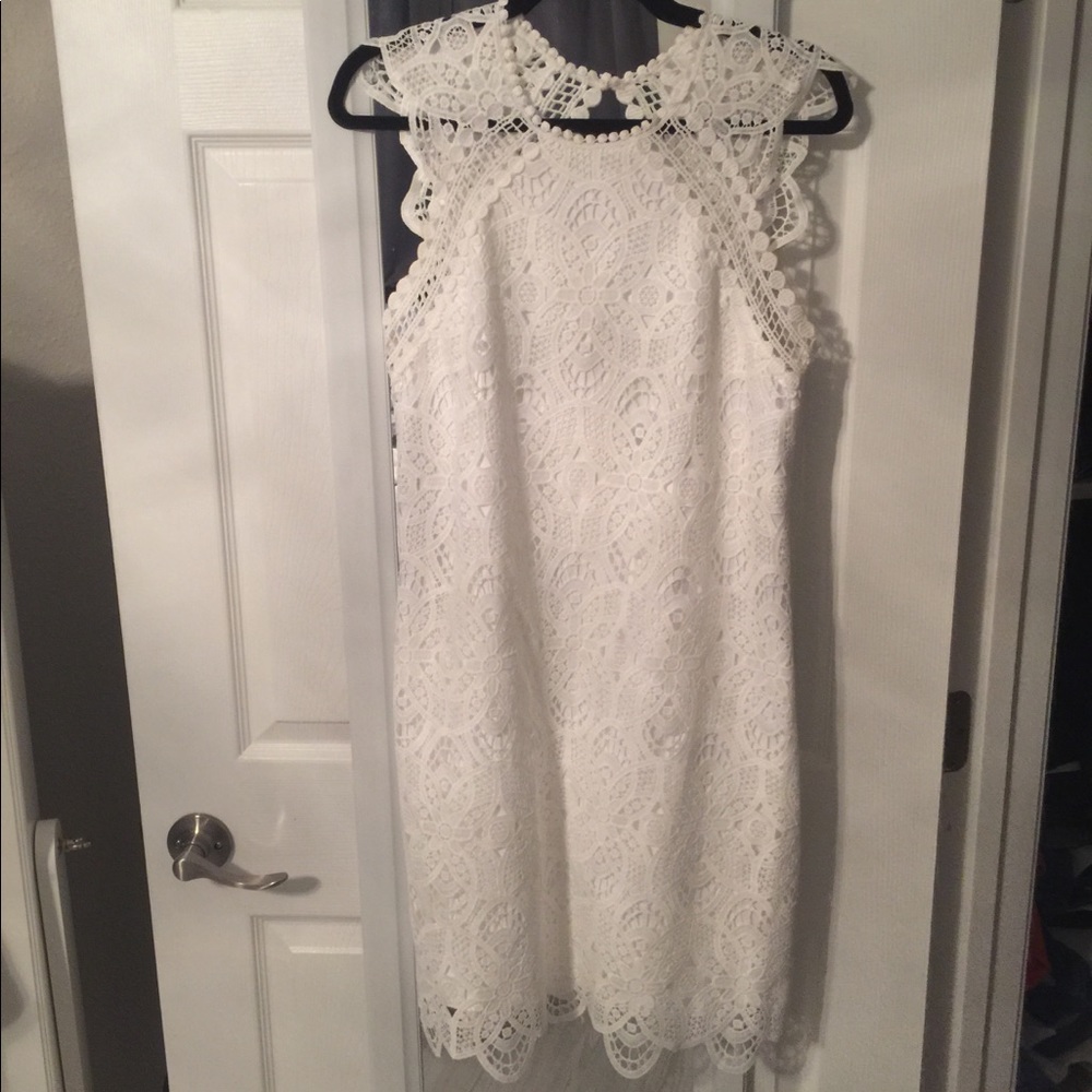 Beautiful lace knee length dress with cutout back